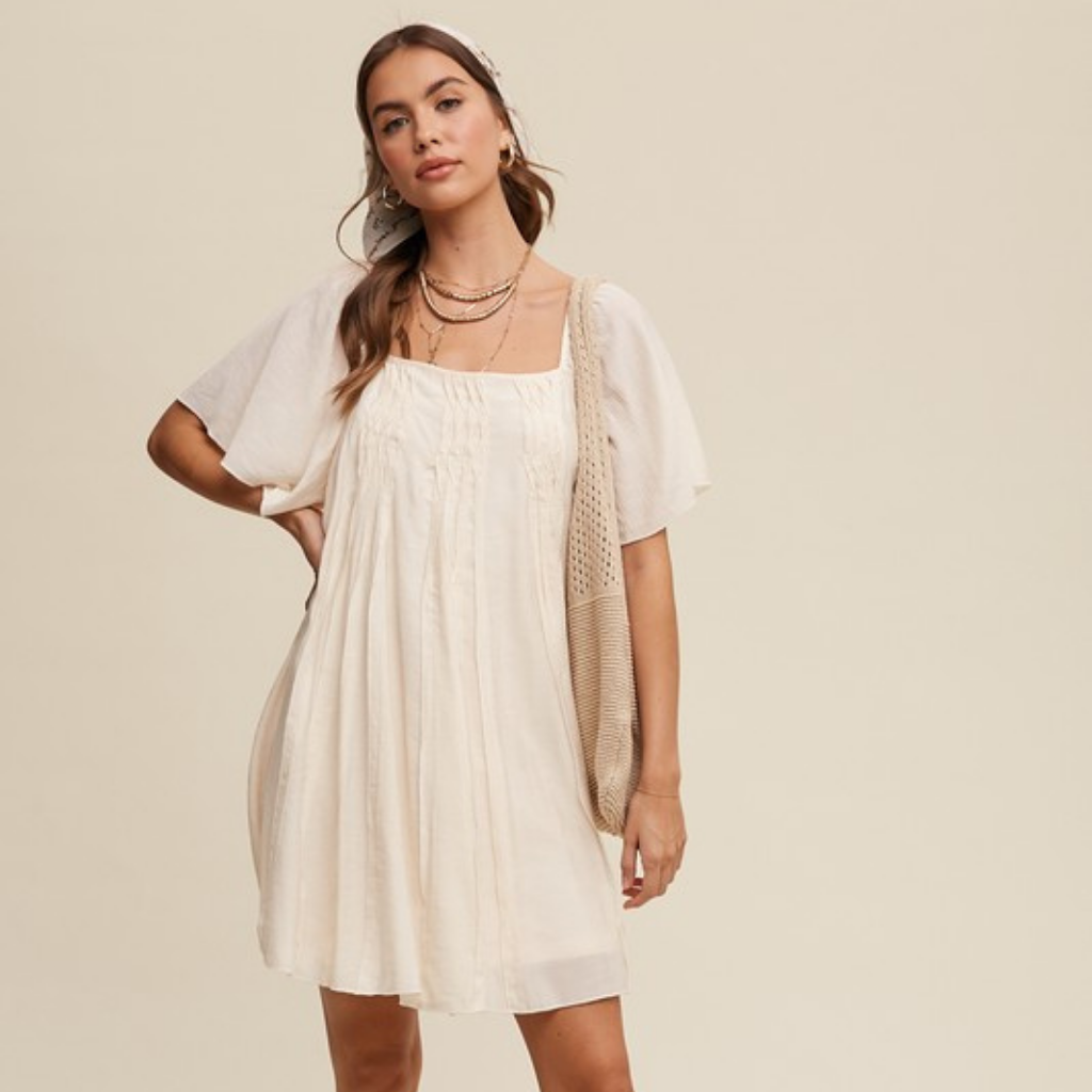 the uma swing dress in cream