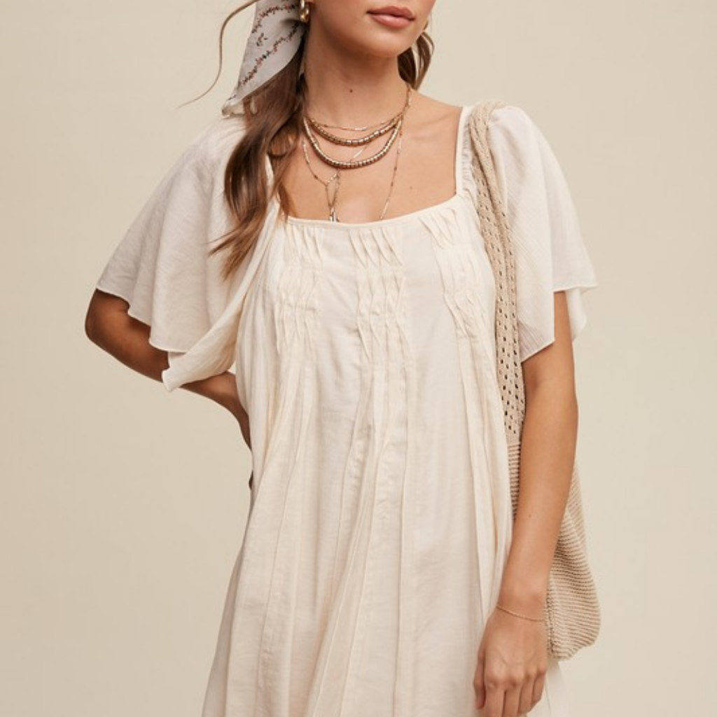 the uma swing dress in cream