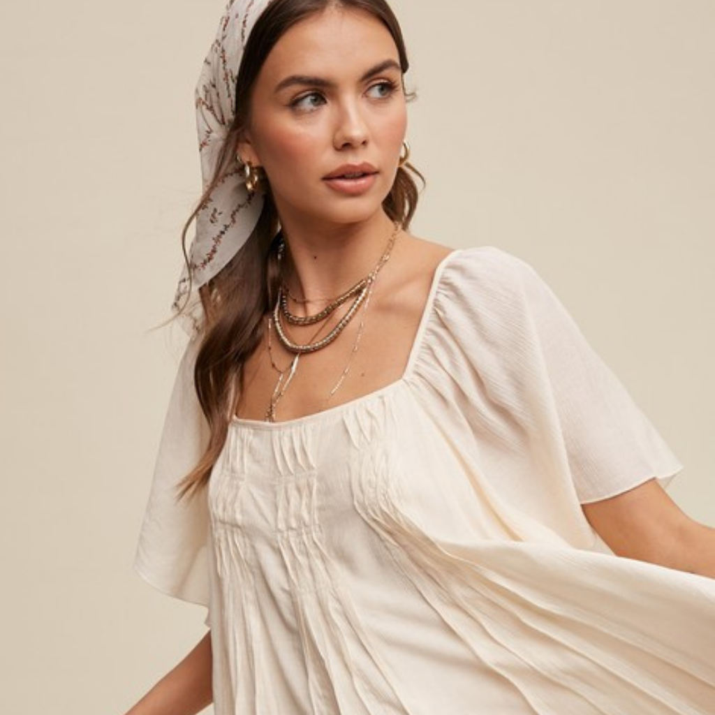 the uma swing dress in cream – blackbird + lou